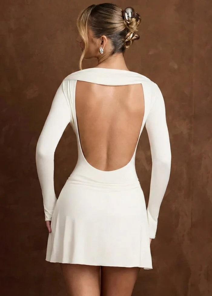 White gown featuring a V-neckline Dress Tailor