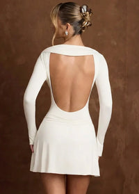 White gown featuring a V-neckline Dress Tailor